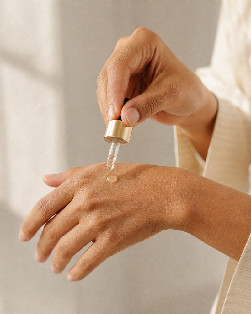 Wshop skincare and makeup products styled on warm neutral linen